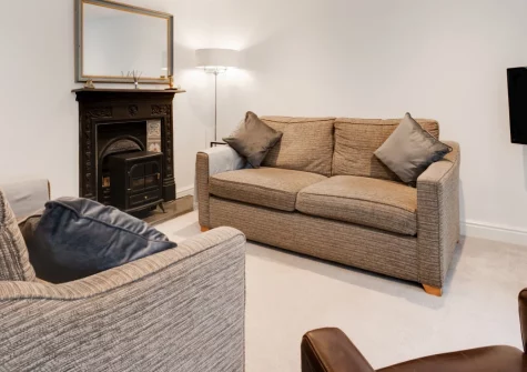 1 Cobbs Well, Fowey is a charming stone cottage in the heart of this riverside town, featuring three elegant bedrooms, a sunny south-facing garden with gazebo, and characterful interiors just moments from Readymoney Cove and waterfront dining.