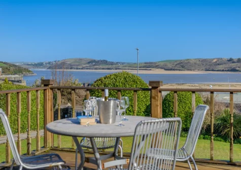 The shared decked patio & alfresco dining area at 1 Pentyre House, Padstow