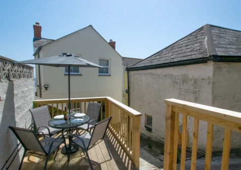The decked terrace & outdoor sitting area at 1 Peverell Cottages, Porthleven