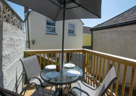 The decked terrace & outdoor sitting area at 1 Peverell Cottages, Porthleven