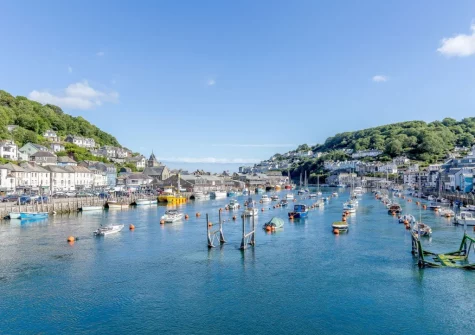 Known for its sandy beach, working harbour and Banjo Pier, Looe is a popular tourist destination offering boat trips, coastal walking, narrow bustling streets and fresh seafood
