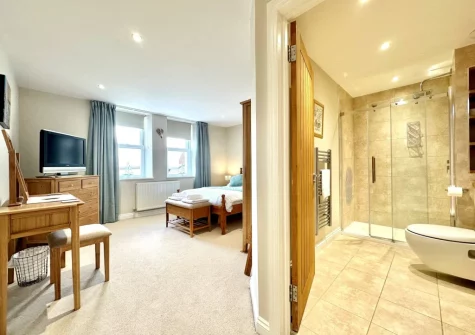 Bedroom #1 & en-suite shower room at 1 Seascape, Westward Ho!