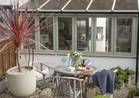 The rear courtyard garden & alfresco dining area at 1 The Cottages, Ludgvan