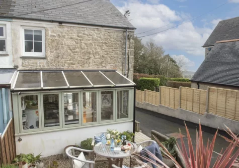 The rear courtyard garden & alfresco dining area at 1 The Cottages, Ludgvan