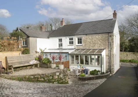 The rear courtyard garden, alfresco dining & outdoor sitting area at 1 The Cottages, Ludgvan