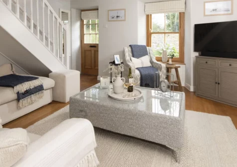 1 The Cottages, Ludgvan is a characterful three-bedroom retreat in peaceful West Cornwall, featuring a traditional wood burner, pretty courtyard garden with glimpses of St Michael's Mount, and easy access to the stunning beaches of Mounts Bay.