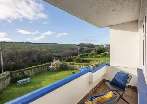 The balcony & outdoor sitting area at 10 The Valley, Porthcurno