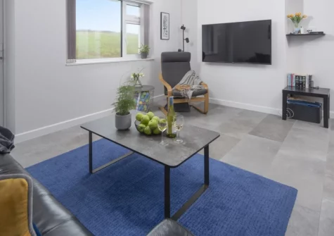 10 The Valley, Porthcurno is a spacious three-bedroom apartment just moments from the golden sands of Porthcurno Beach, featuring a private balcony with rural views, thoughtful family-friendly extras, and the iconic Minack Theatre on your doorstep.