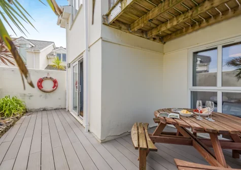 The enclosed decked terrace & alfresco dining area at 10 The Watermark, Newquay