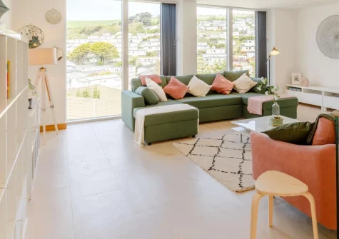 11 Beachdown, Challaborough is a stunning reverse-level house just moments from sandy Challaborough Bay, featuring bright bi-fold doors onto a spacious terrace, flexible sleeping for up to nine guests, and spectacular South Devon coastal walks.