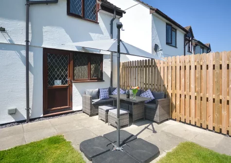 The patio, alfresco dining area & garden at 18 Raleigh Close, Padstow