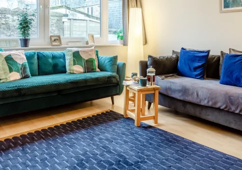 18 St Nicholas Court, St Ives is a stylish two-bedroom apartment in the heart of this artistic coastal town, just steps from Porthmeor Beach, featuring contemporary interiors, private parking, and easy access to galleries and restaurants.