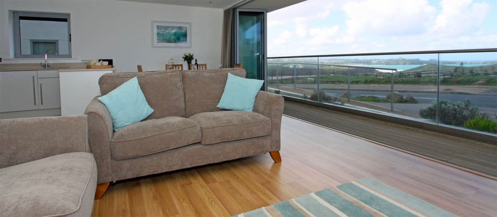 18 Zenith, Newquay is a well-located two-bedroom apartment with sea views just 500 yards from Porth Beach. This modern property sleeps four and includes open-plan living, furnished balcony, two bathrooms and secure garage parking.