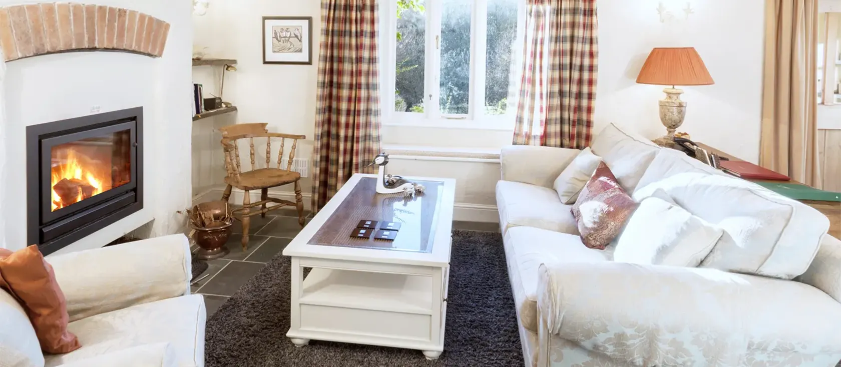 2 Bittadon Cottages, Bittadon is an atmospheric stone cottage surrounded by farmland and countryside. This spacious home sleeps eight in four bedrooms, one on the ground floor, and has a fantastic sprawling garden with a summerhouse, pond and patio.