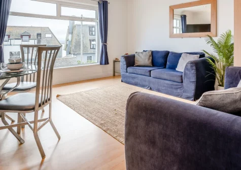 2 Clearwater, St Ives is a cosy one-bedroom apartment near Porthminster Beach, with magnificent bay views towards Godrevy Lighthouse, a private balcony, calm interiors, and easy access to St Ives' cobbled streets and golden beaches.