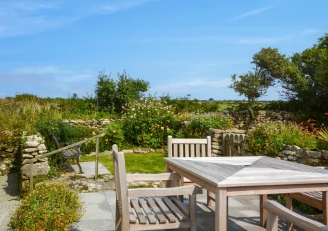 The large patio, alfresco dining area & garden at 2 The Chapel, Rinsey