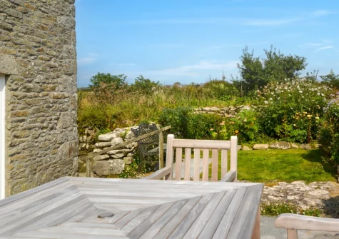 The large patio, alfresco dining area & garden at 2 The Chapel, Rinsey