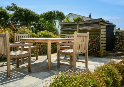 The large patio, alfresco dining area & garden at 2 The Chapel, Rinsey
