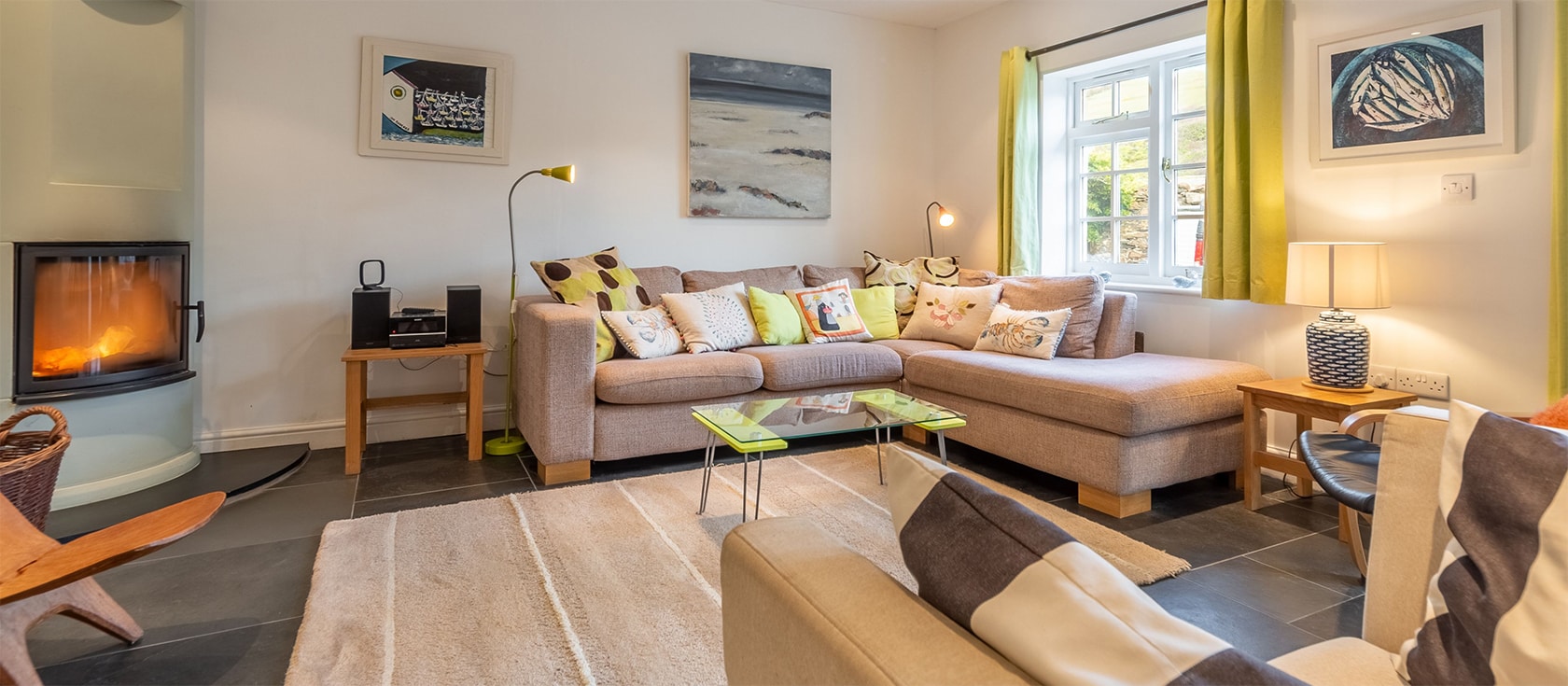 2 Fish Cellars, Port Quin is a unique holiday cottage in a peaceful National Trust owned cove. The converted pilchard shed has been beautifully modernised to include four bedrooms, open living room, utility room, dining kitchen & courtyard parking steps from the beach.