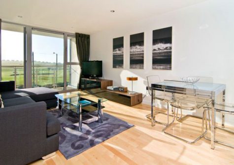 The living area has views over the golf course towards Fistral Bay
