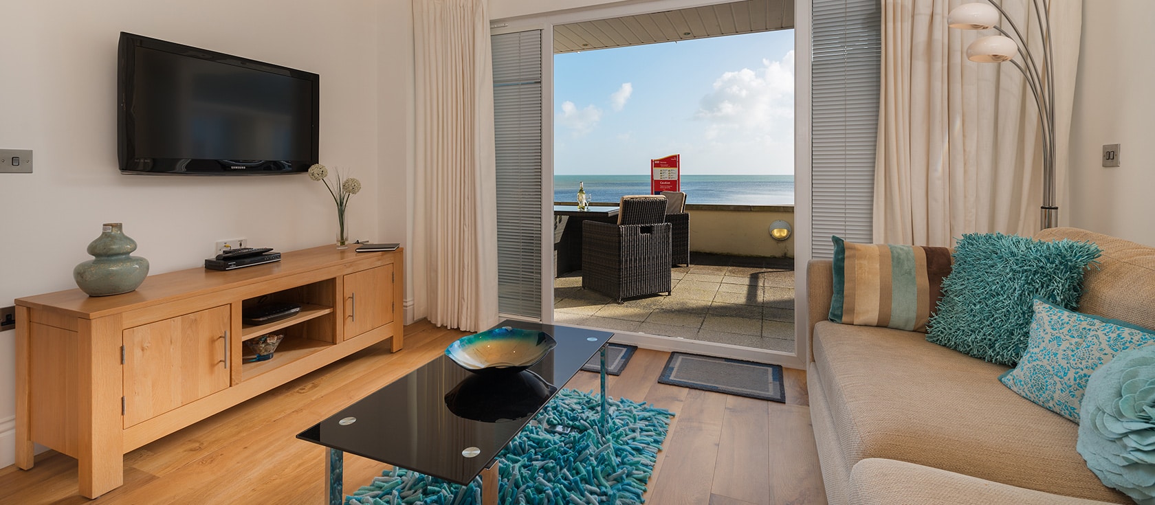 A stunning ground floor apartment literally right at the edge of the sea. It opens out directly on to a private beach side terrace where you can dine alfresco and enjoy panoramic 180 degree views across Start Bay.