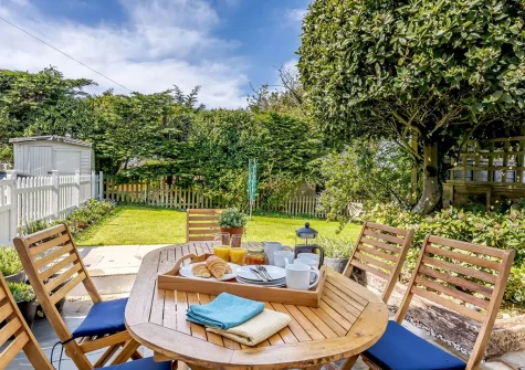The patio, alfresco dining area & garden at 3 Gabberwell Cottages, Kingston