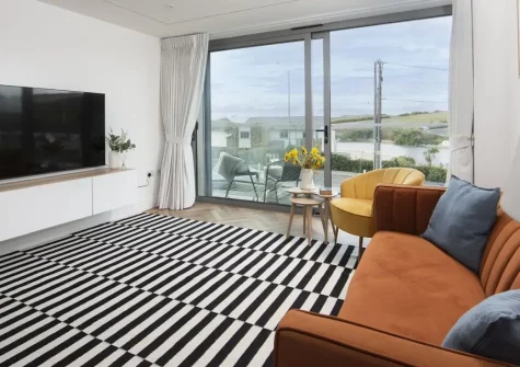 3 Oasis Sands, Newquay is a luxurious two-bedroom apartment with stunning sea views, just steps from Porth Beach. Enjoy modern amenities, a private balcony, and direct beach access—perfect for families seeking a memorable Cornish coastal escape.