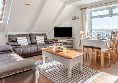 3 Pentyre House, Padstow is a charming two-bedroom apartment offering breathtaking estuary views. Perfect for couples and families seeking a coastal escape in this picturesque Cornish harbour town with access to shops, restaurants, and beaches.