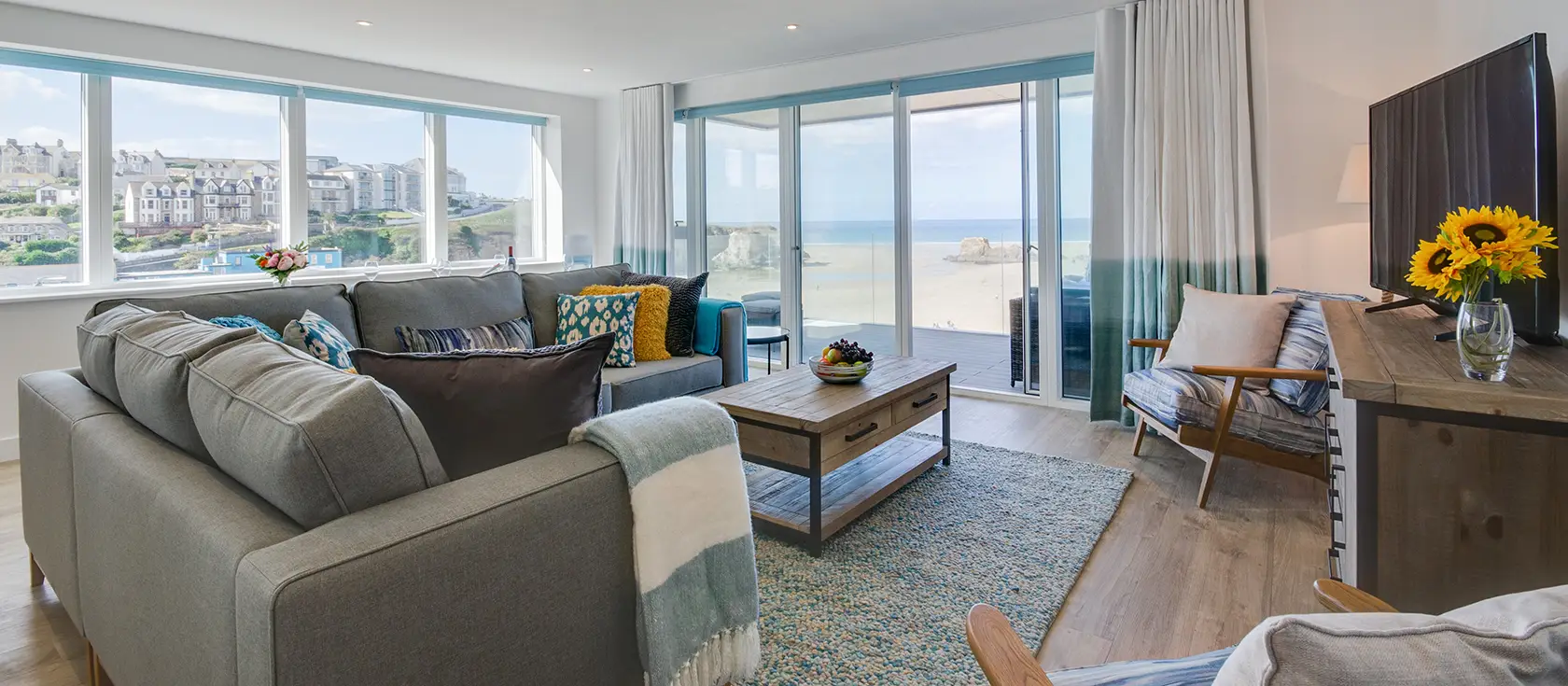 34 The Dunes, Perranporth is a spectacular three-bedroom beachfront apartment with two sun-drenched balconies and sublime Atlantic Ocean views. Enjoy direct beach access, premium Bosch appliances, and Cornwall's most stunning coastline.