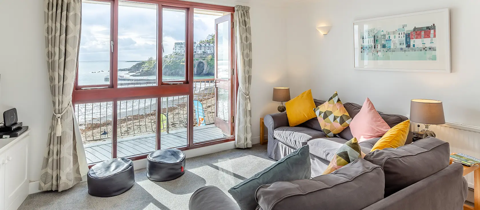 4 Admiralty Court, Looe is a stylish split-level apartment with stunning sea views from every room. Featuring a magnificent 30-foot balcony overlooking East Looe Beach and direct beach access from the communal garden, perfect for families.