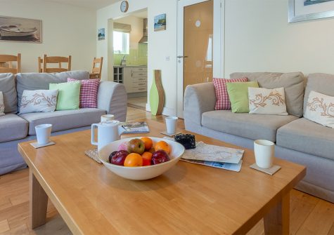 4 Pentire Rocks, New Polzeath is three bedroom two bathroom contemporary maisonette within walking distance of pub, shops & surfing beach. Modern open-plan living room with tasteful decor is complemented by a sheltered patio garden with BBQ.