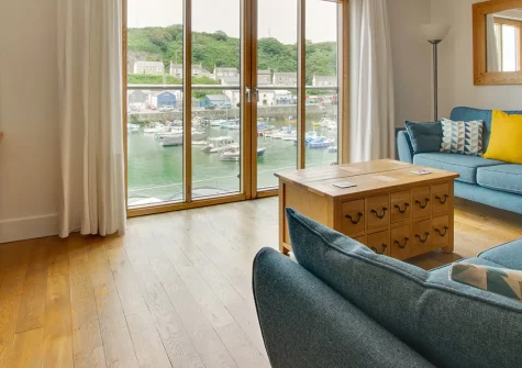 4 St Elvans Courtyard, Porthleven is a stylish duplex apartment with stunning harbour views, modern amenities, and coastal charm. Perfect for families seeking Cornwall's natural beauty, Porthleven's character, and memorable seaside holidays.