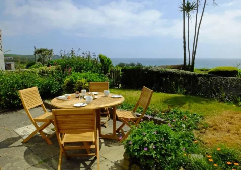 The patio, alfresco dining area & enclosed garden at 4 Withey Cottages, Perranuthnoe