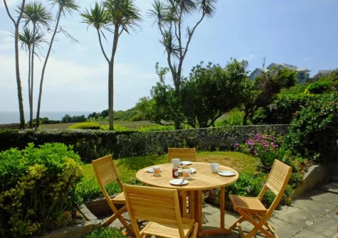 The patio, alfresco dining area & enclosed garden at 4 Withey Cottages, Perranuthnoe