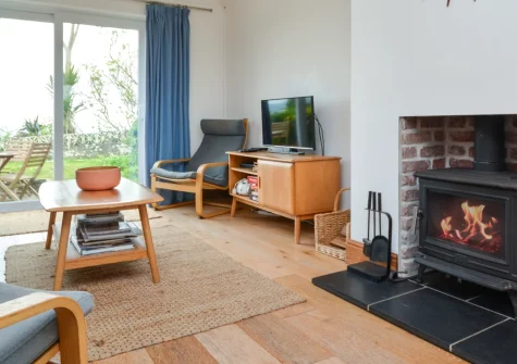 4 Withey Cottages, Perranuthnoe is a spacious three-bedroom home with sweeping sea views across Mount's Bay, featuring a peaceful enclosed garden, wood burner warmth, and direct access to the South West Coast Path from this quiet coastal village.