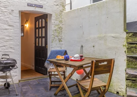 The rear paved courtyard & outdoor sitting area at 45 North Street, Fowey