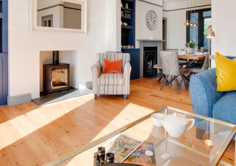 5 Coastguard Cottages, Torquay, is a refurbished 18th-century clifftop retreat with stunning sea views across Torbay. Enjoy coastal walks, a south-facing terrace, and easy access to beaches and attractions. Perfect for family getaways.