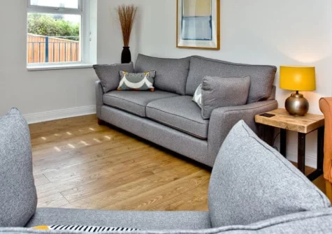 5 Devon Beach Court, Woolacombe is a beautifully appointed three-bedroom apartment on The Esplanade, featuring a private roof terrace with Lundy Island sea glimpses, stylish interiors, and direct access to award-winning Woolacombe Beach.