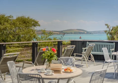 The shared decked terrace, alfresco dining & outdoor sitting area at 5 Pentyre House, Padstow