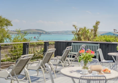 The shared decked terrace, alfresco dining & outdoor sitting area at 5 Pentyre House, Padstow