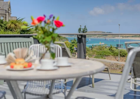 Enjoy views of the estuary from the shared decked terrace, alfresco dining & outdoor sitting area