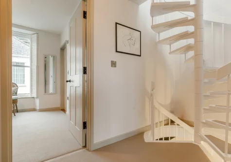 The spiral stairs up to the first floor at 51 Esplanade, Fowey