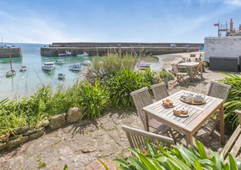 The shared front terrace with designated alfresco dining / sitting area at 6 Fishermans Square, Mousehole
