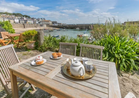 The shared front terrace with designated alfresco dining / sitting area at 6 Fishermans Square, Mousehole