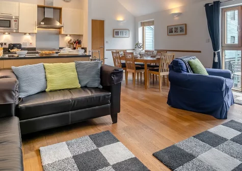 6 St Elvan's, Porthleven is a charming harbourside apartment with open-plan living and balcony access. Enjoy golden beaches, coastal walking paths, and village attractions. Perfect for creating wonderful family memories in beautiful South Cornwall.