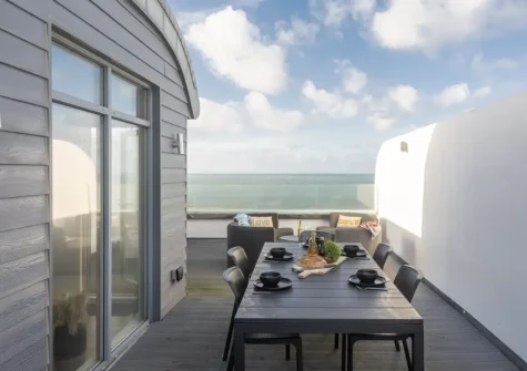 The decked roof terrace & alfresco dining area at 66 Pentire, Newquay