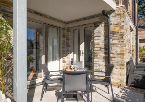 The covered patio & alfresco dining area at 7 The Old Station Master's House, Fowey
