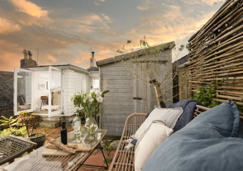 The tiered rear patio garden & outdoor sitting area at 8 Millpool, Mousehole