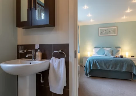 Bedroom #1 & en-suite shower room at 8 Ocean View, Polruan