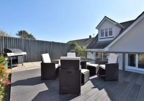 The decked patio, barbecue & alfresco dining area at 8 Ocean View, Polruan
